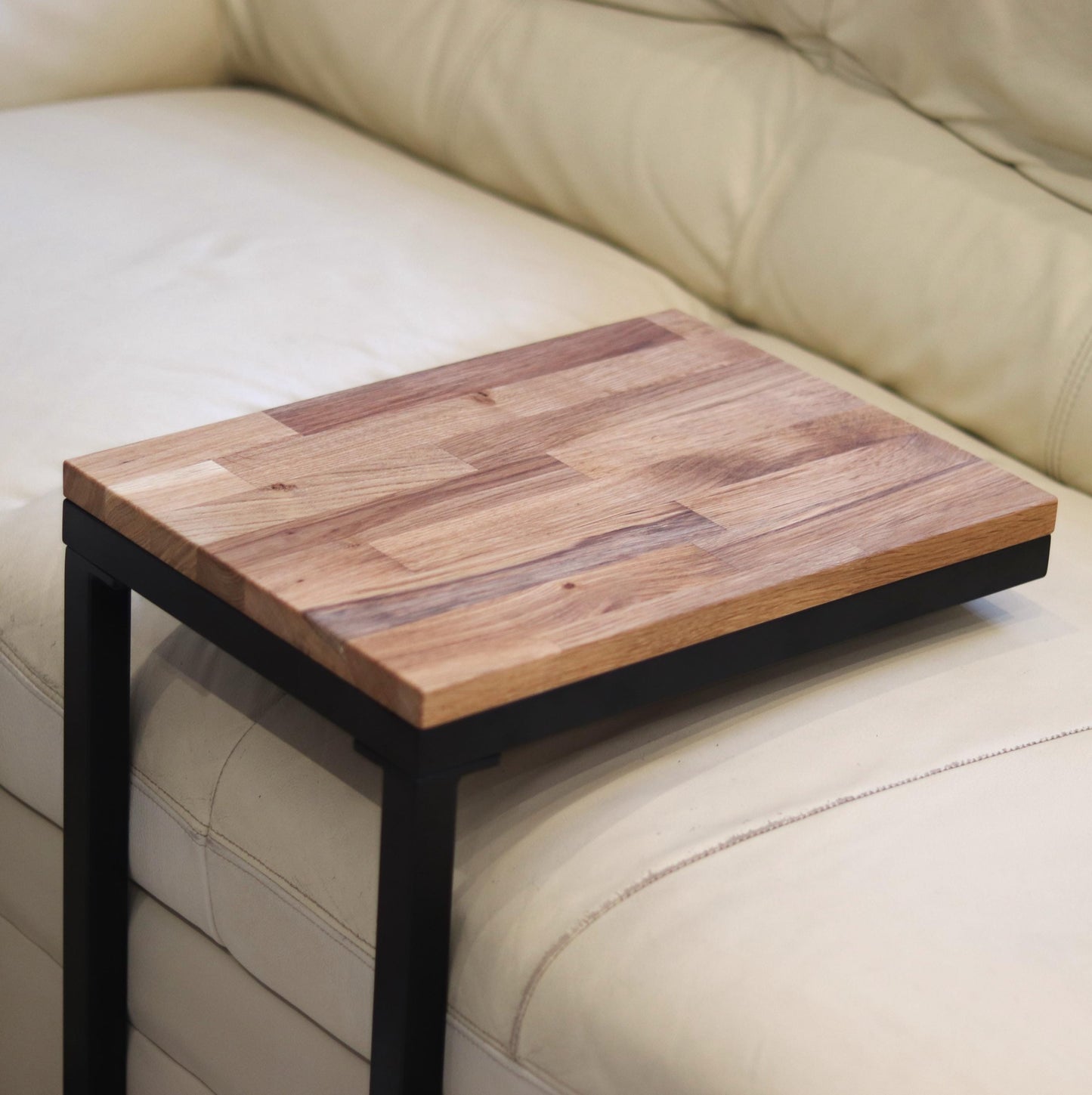 Handmade C-shaped sofa table shown in a living room