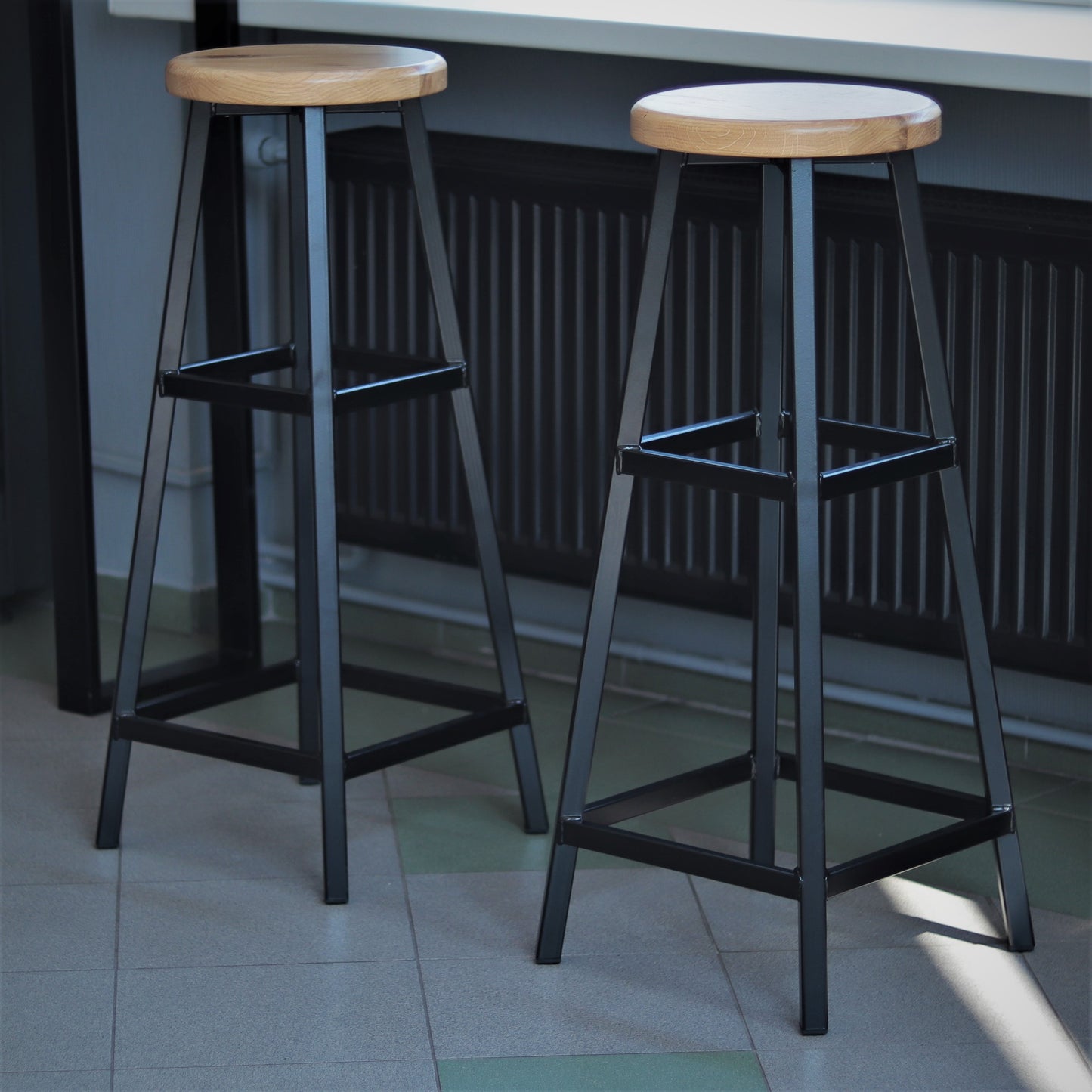 Handmade metal bar stool, angled view