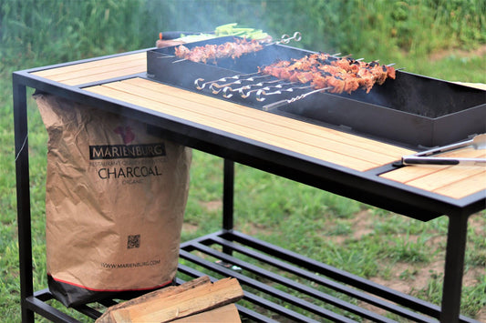 Modern outdoor charcoal grill table in powder-coated steel with hardwood panels