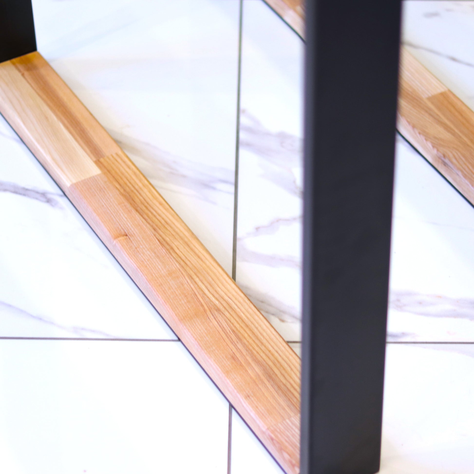 Powder-coated steel table legs with an oak crossbar