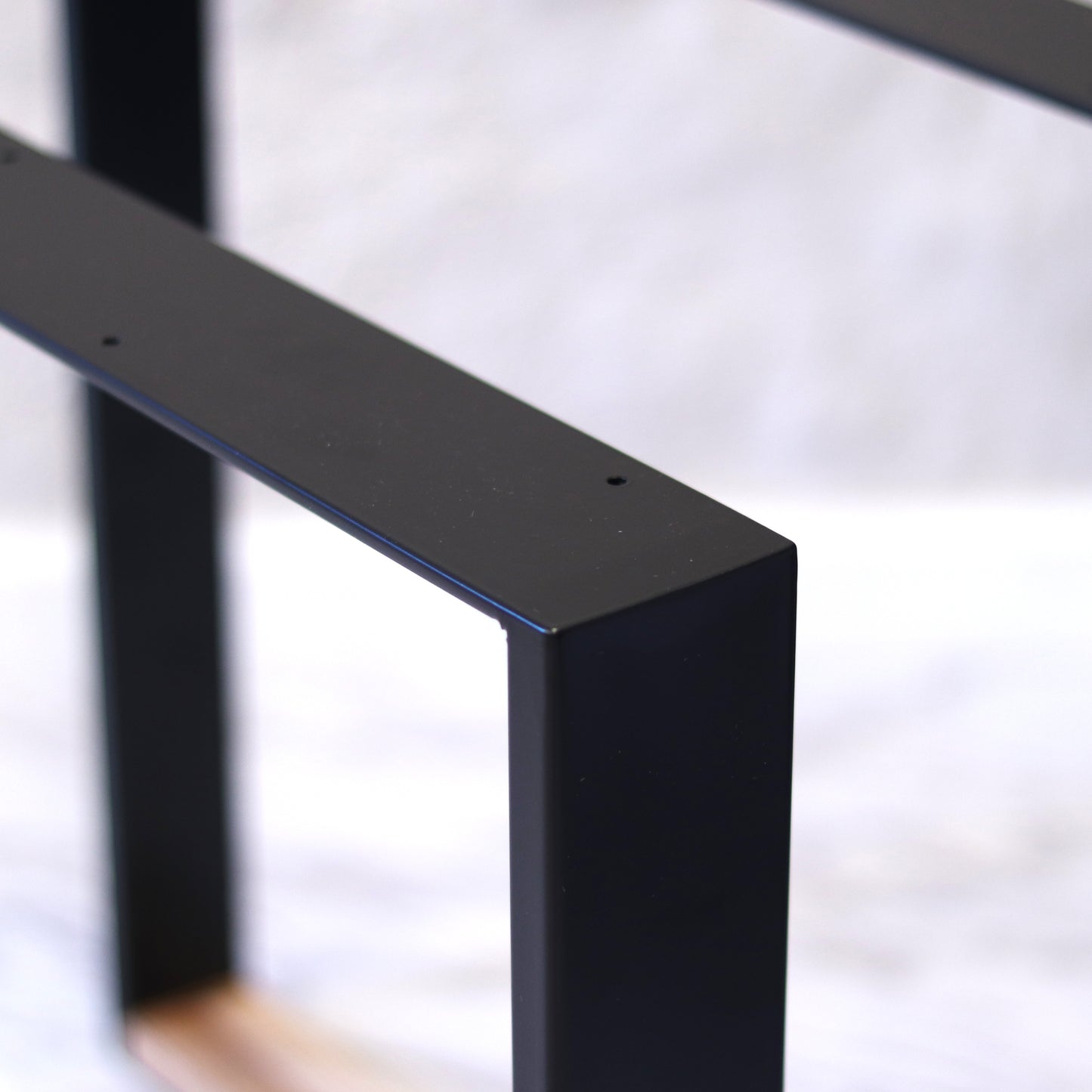 Modern Nordic table base supporting a tabletop