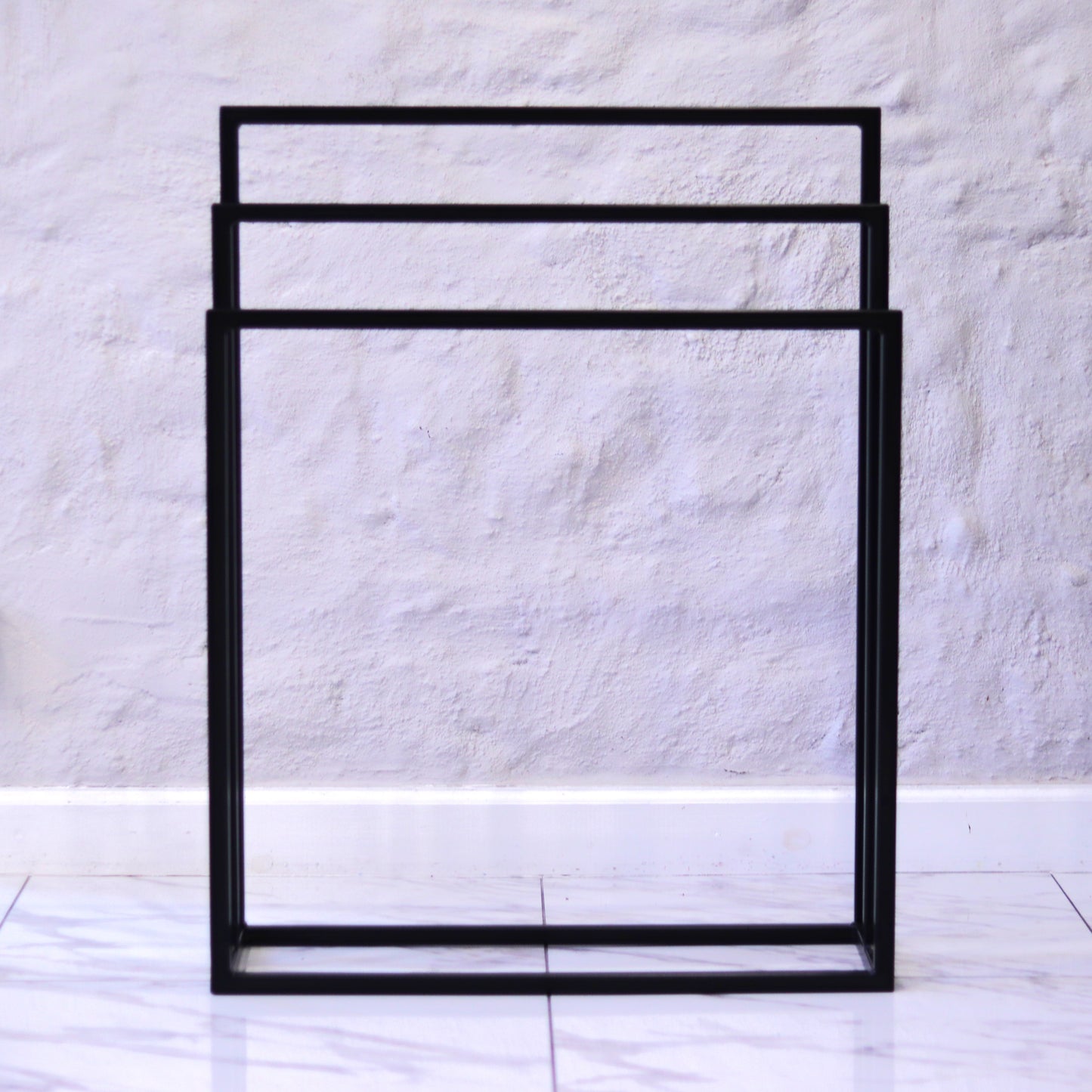 Freestanding towel rack, detail of the square tubing
