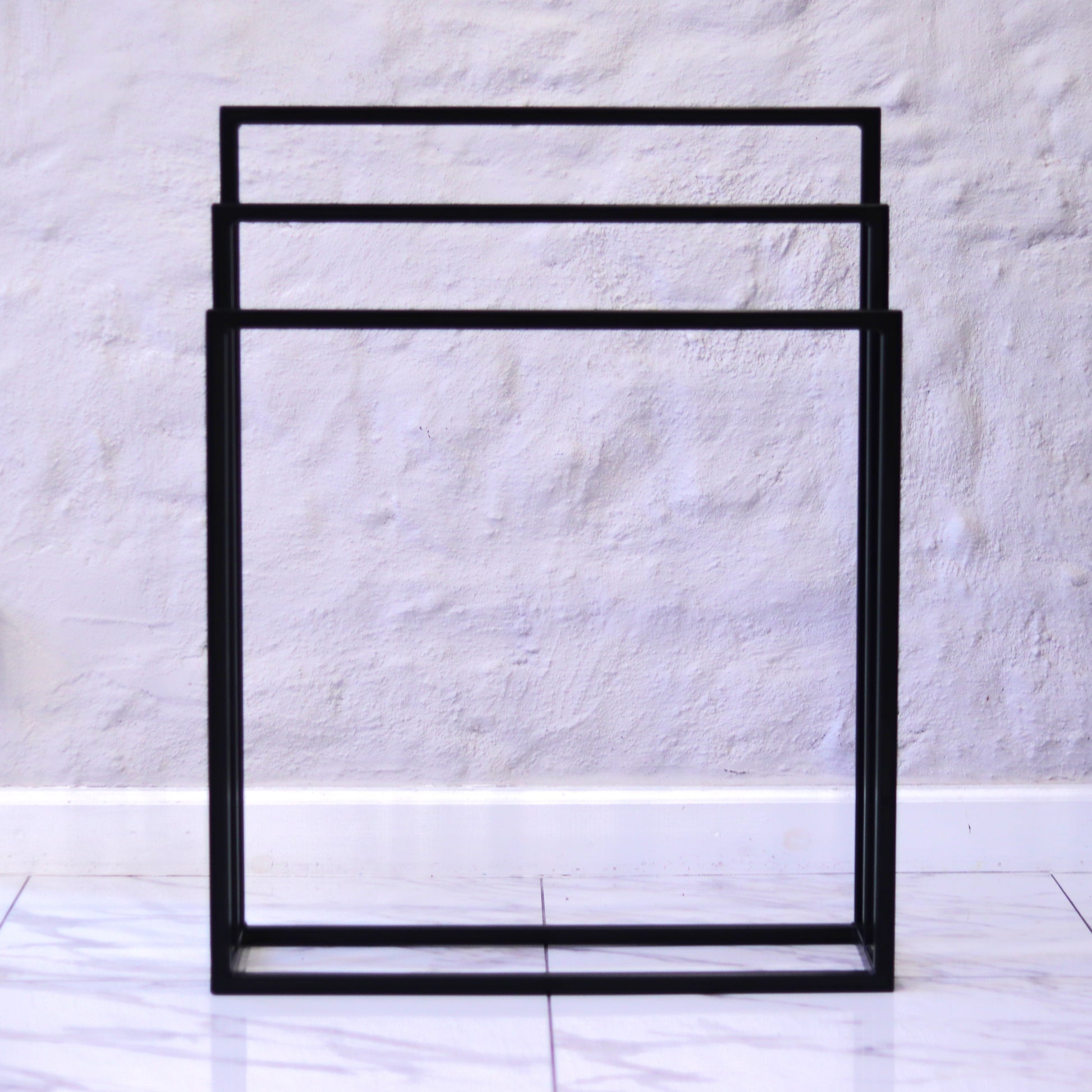 Freestanding towel rack, detail of the square tubing