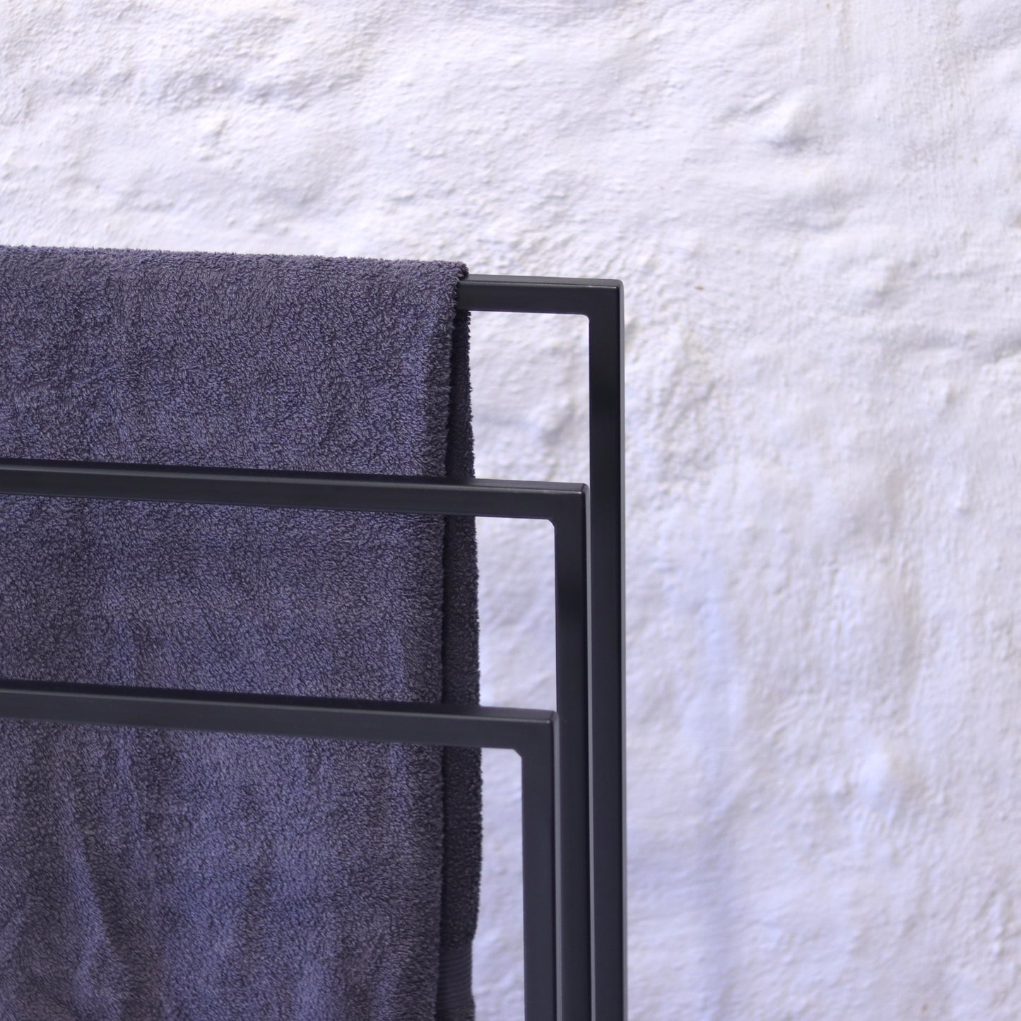 Modern powder-coated towel rack, front view