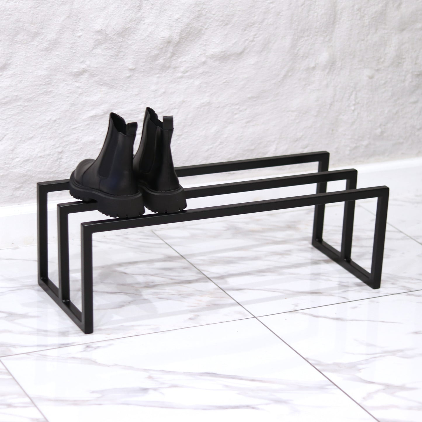 Freestanding steel shoe rack in black powder coating