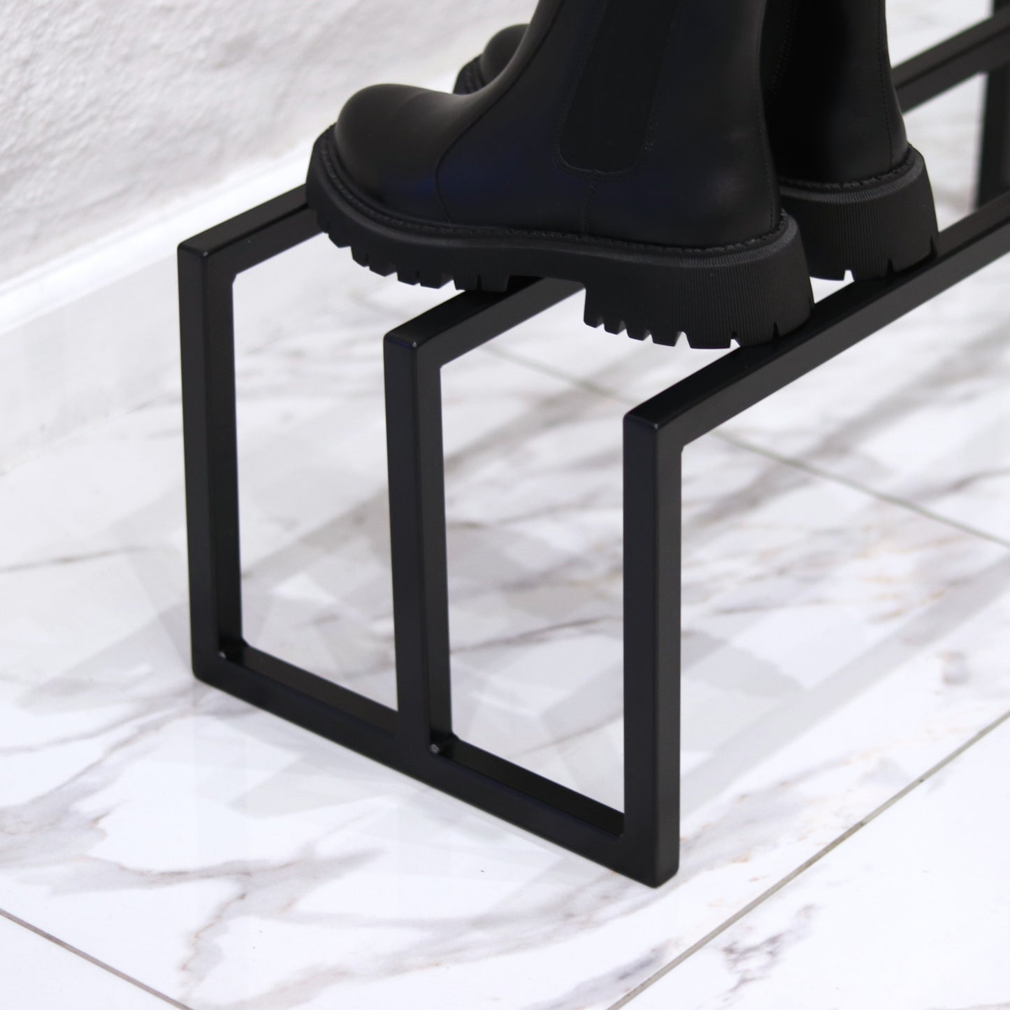 Modern steel shoe storage rack, front view