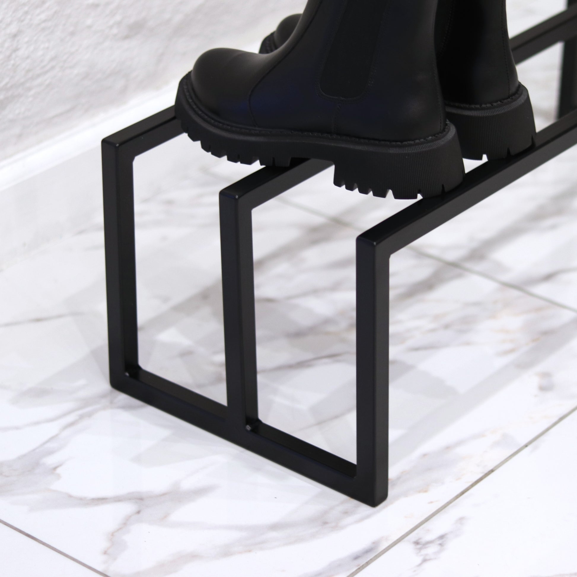 Modern steel shoe storage rack, front view