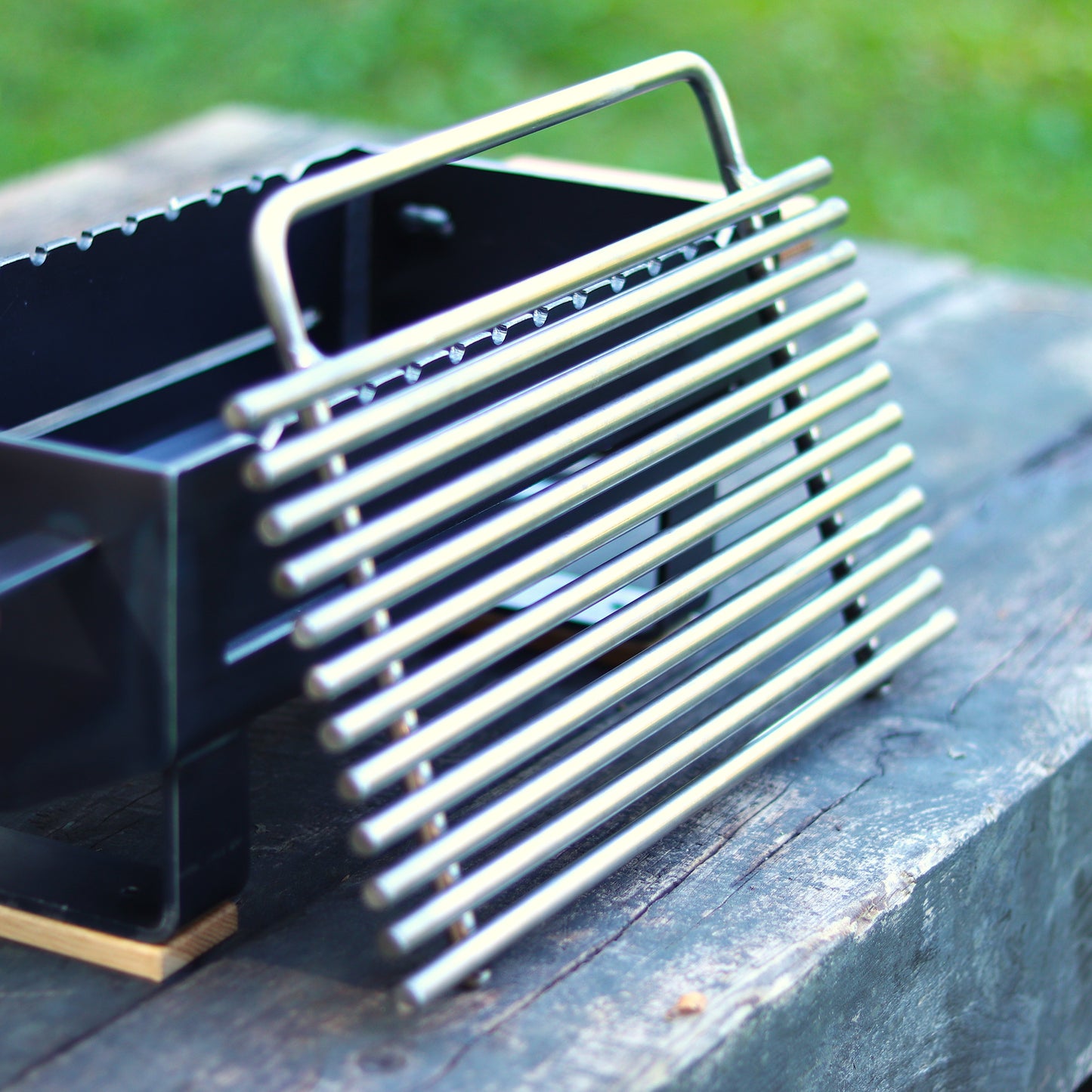 Close-up of handmade steel hibachi grill showing weld and cooktop detail