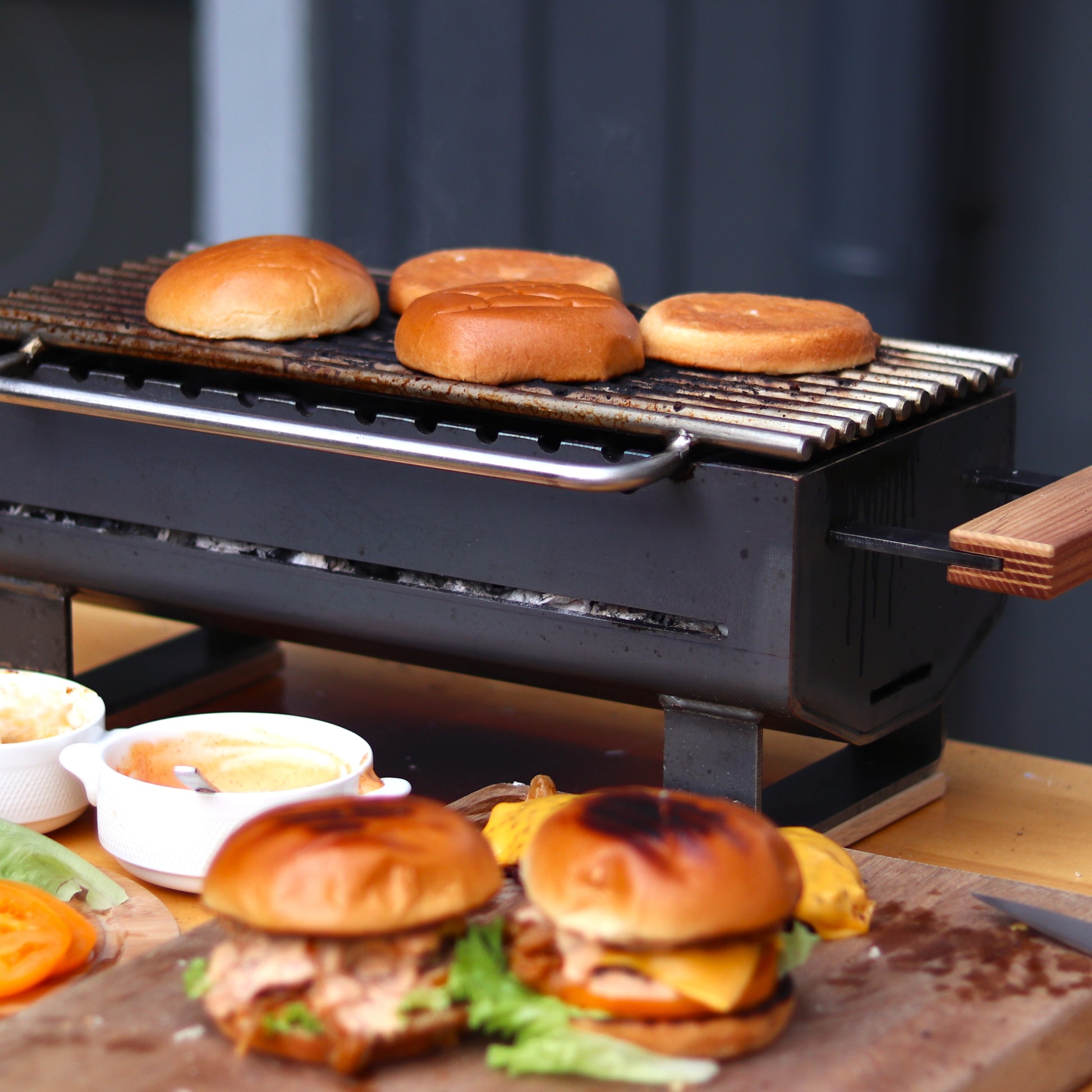 Portable hibachi charcoal grill in use with glowing charcoal
