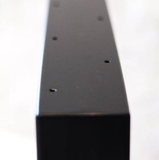 Steel table base for a desk or bench, angled view