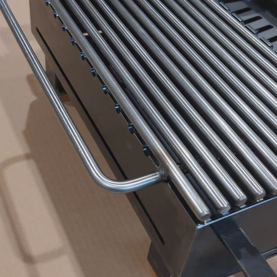 video showing 4 hibachi grills in row on brown background